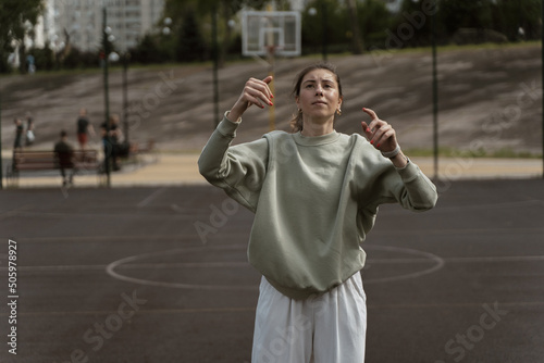 girl throws the ball into the ring on the basketball court © Дмитрий Дементьев