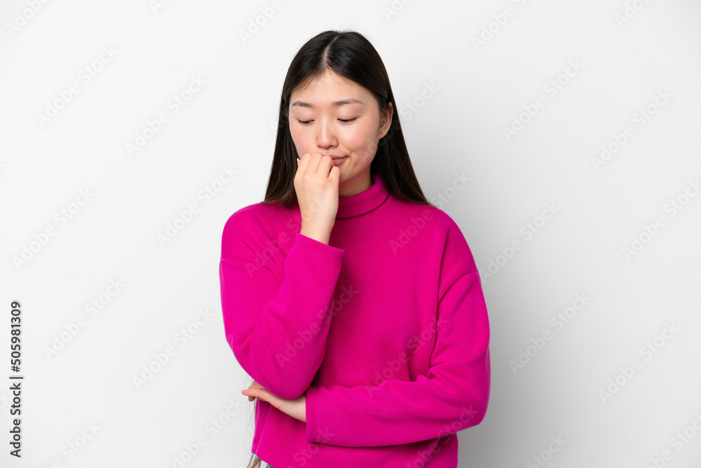 Young Chinese woman isolated on white background having doubts Young Chinese woman isolated on white background having doubts