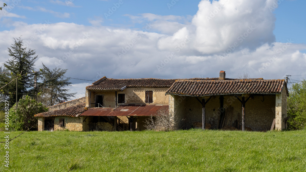 Old country house, in the middle of the fields, on a beautiful sunny spring day