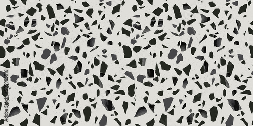 Black terrazzo flooring seamless pattern with monochrome marble rocks. Realistic interior material background of mosaic stone. Trendy fashion print wallpaper for textile project or web backdrop.