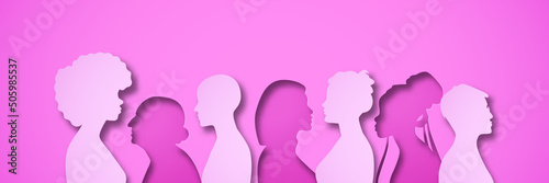 Pink women people group illustration in layered 3D paper cut style. Female team for women's issues or breast cancer awareness concept. Papercut design of diverse girls silhouette standing together. photo