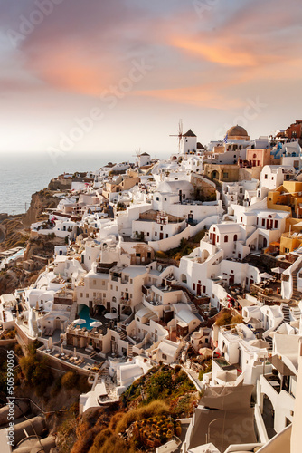 Fototapeta Naklejka Na Ścianę i Meble -  The Oia village on Santorini island in Greece during beautiful sunset with colorful clouds.