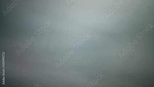 Abstract blur background with brown gray, black, white and earth tones.