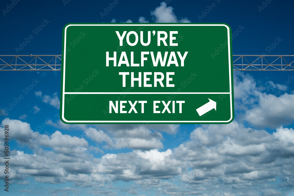 You're Halfway There motivational highway sign.