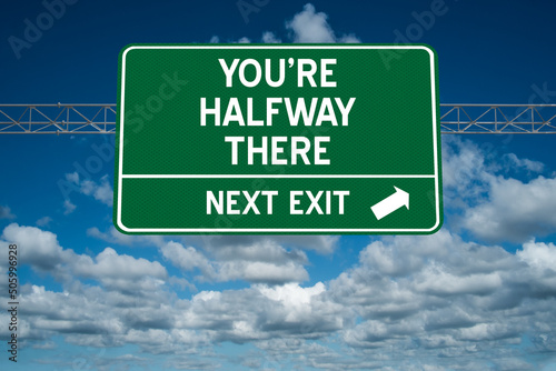 You're Halfway There motivational highway sign.