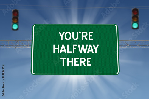 You're Halfway There motivational highway sign. photo