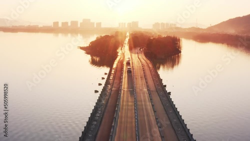 aerial view of road in hangzhou xianghu lake scenic spot at sunset
 photo