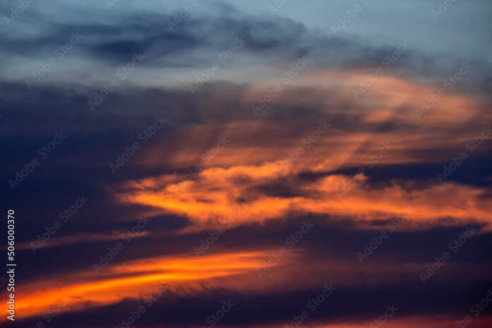 Dramatic sunrise sky with clouds.