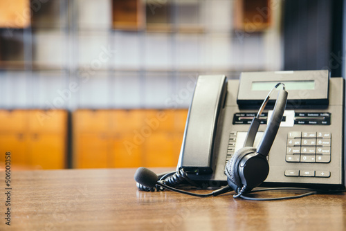 Headset and customer support equipment at call center ready for actively service , Communication support, call center and customer service help desk.for (call center) concept .