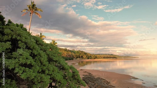 Fiji aerial footage warm sunset over sandy beach tropical paradise at Maui Bay photo