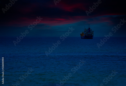 An oil tanker is sailing in the middle of the sea.