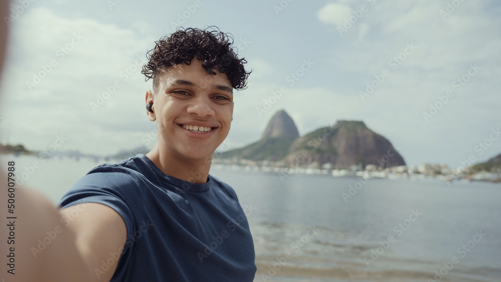 Latin young man, famous beach Rio de Janeiro, Brazil. Latin summer vacation holiday. Latin young man, famous beach Rio de Janeiro, Brazil. Latin summer vacation holiday.