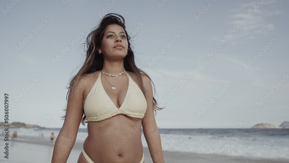 Latin young girl, famous beach Rio de Janeiro, Brazil. Latin summer vacation holiday. - obrazy, fototapety, plakaty 