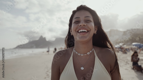 Latin young girl, famous beach Rio de Janeiro, Brazil. Latin summer vacation holiday. photo