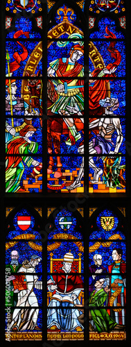 Stained-glass window depicting Catholic social reform, above Saint Martin of Tours, below Pope Leo XIII. Votivkirche – Votive Church, Vienna, Austria. 2020-07-29. 