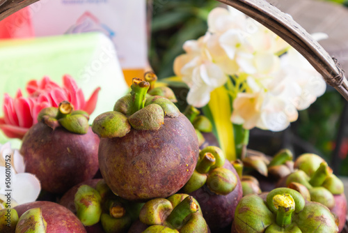close up of mangosteen in the basket