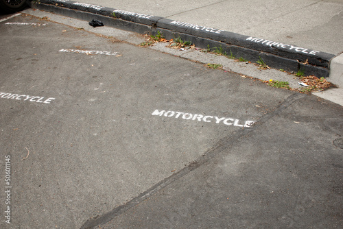 A view of a parking area designated for motorcycle vehicles.
