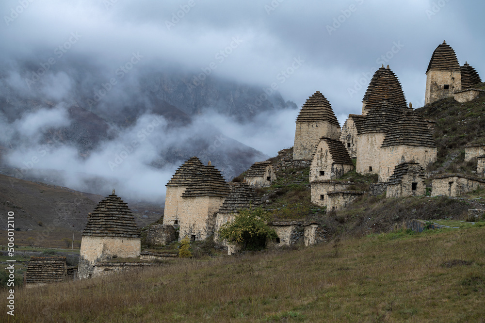 Ancient grave complex Dargavs on a foggy October day. Northern Ossetia-Alania, Russian Federation