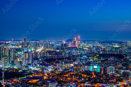 Seoul city night view taken from Namsan Mountain in Seoul, South Korea at night time © SEUNGJIN