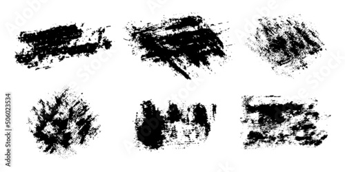 A set of graphic brushes. Dense grunge vector texture. Separate on a white background. Scratches  paint stains  smears. Ink. Vintage effect.