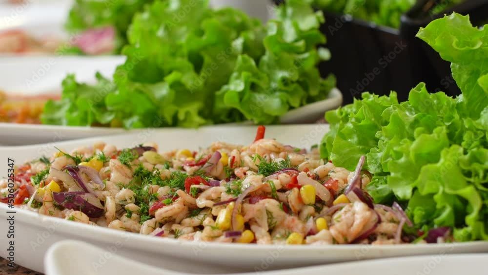 Shrimp salad.
Shrimp salad mixed with vegetables.
Shrimp salad.
Shrimp salad mixed with vegetables.