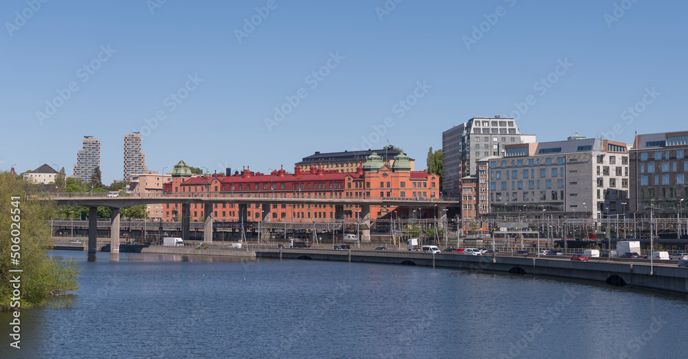 The district Norrmalm at the canal Karlbergskanalen with the transit route Klarastrandsleden and the northern railway passage to the central station a sunny day in Stockholm