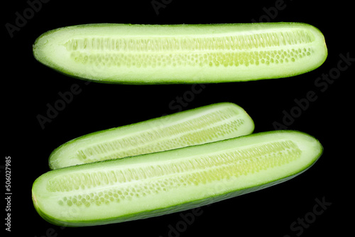 Long green cucumber on black