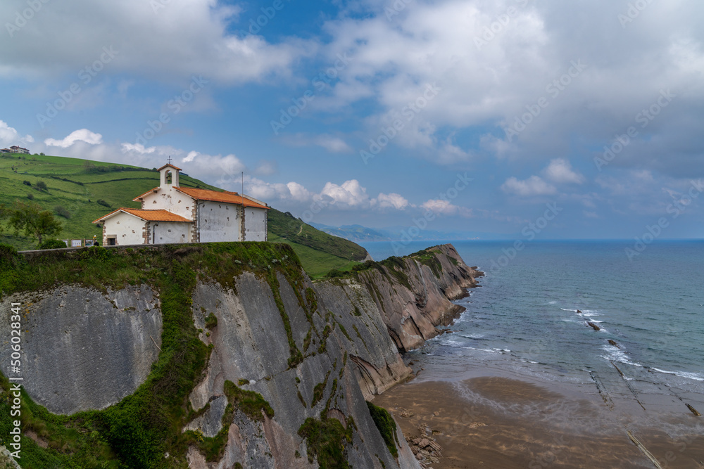 the San Telmo Hermitage chapel and Flysch rock formations on the Basque Country coast in Zumaia