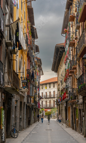 narrow street with colorful buildings in the historic city center of Tolosa © makasana photo