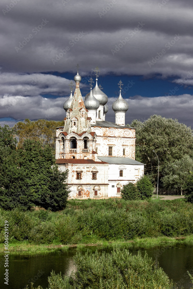 Ancient medieval Russian church on the bank of the river