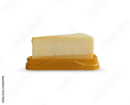Sliced classic new york cheesecake on triangle brown plate isolated on white background with clipping path.