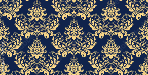Wallpaper in the style of Baroque. Seamless vector background. Gold and dark blue floral ornament. Graphic pattern for fabric, wallpaper, packaging. Ornate Damask flower ornament