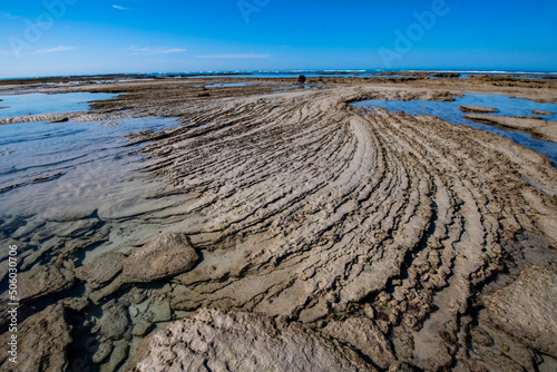 Beach and rock formation photo