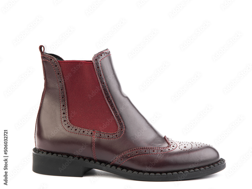 Women's autumn chelses red leather boots isolated white background. right side view. Fashion shoes. Photoshoot for shoe shop concept. Women's autumn chelses red leather boots isolated white background. right side view. Fashion shoes. Photoshoot for shoe shop concept.