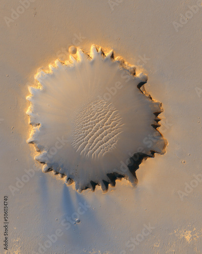 Crater on planet surface. Elements of this image furnished by NASA.