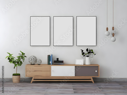 Room interior mockup with 3 blank frames  desk and objects  plant  and hanging lamp. 3d Rendering. 3d interior