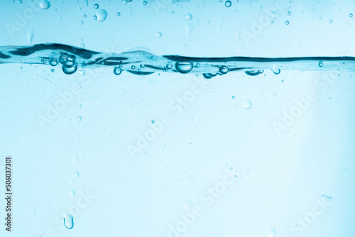 blue splash of water in a glass vessel