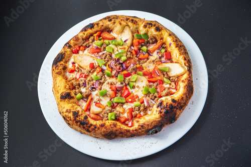 pizza on the black background, top view