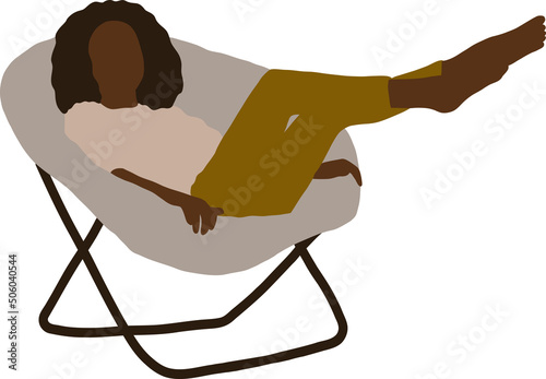 Black girl sit on a modern armchair