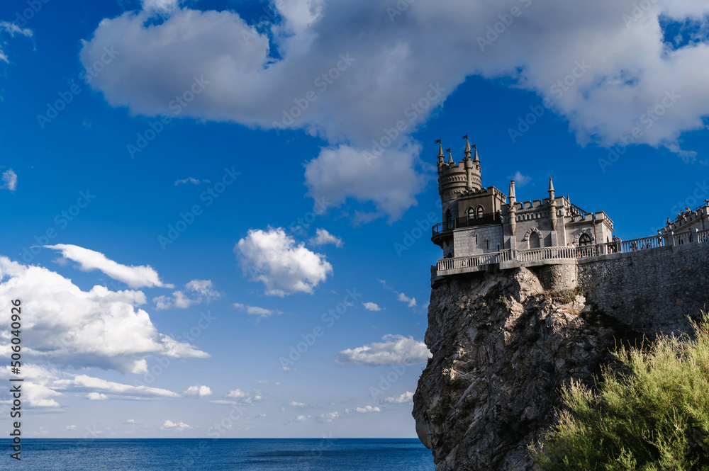 Swallow's Nest Castle in Crimea on a rock on a sunny summer day. Famous tourist landmark in Russia Swallow's Nest Castle in Crimea on a rock on a sunny summer day. Famous tourist landmark in Russia