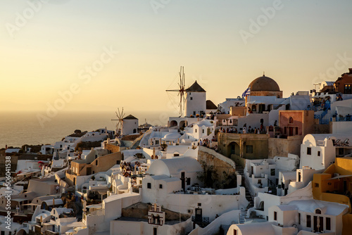 Sunset sky above traditional Greek village Oia on Santorini island in Greece. Santorini iconic view.