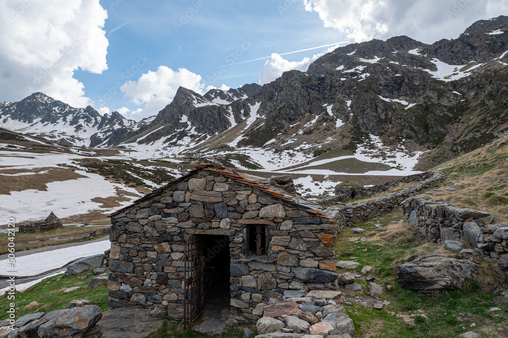 Rural cabin with the typical dry stone wall in Arcalis, Ordino in Andorra.