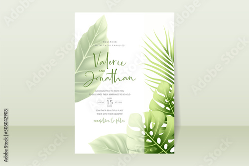 Wedding invitation template with realistic tropical summer leaves © CLton
