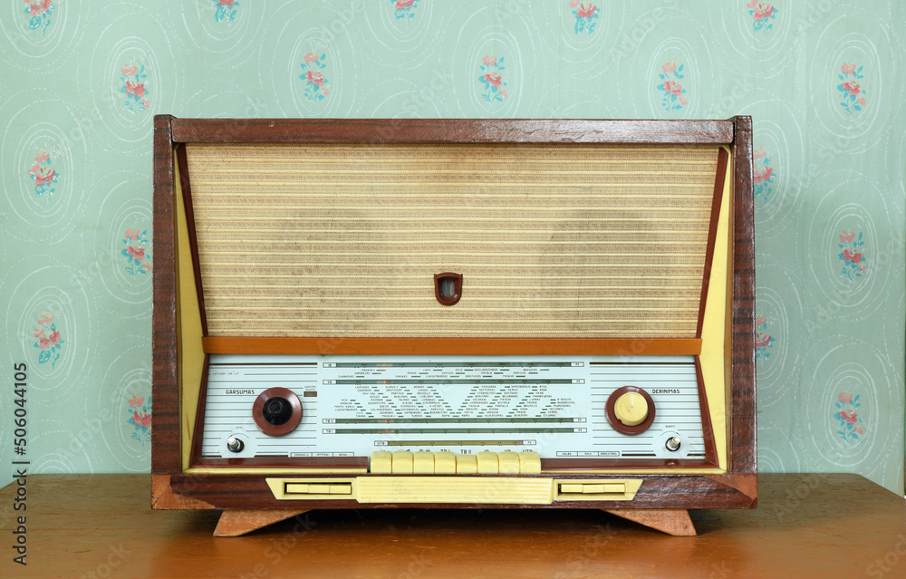 Vintage radiogram (radio) on the background of old wallpaper. Latvian  Soviet vintage radiola (radio) was produced from 1965 to 1968. Stock Photo  | Adobe Stock