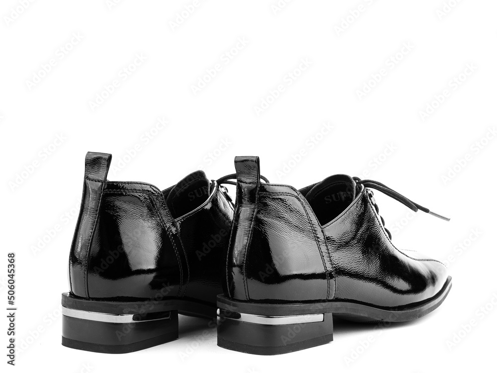 Women's autumn leather jodhpur boots with laces and average heels, isolated white background. Back side view. Fashion shoes. Photoshoot for shoe shop