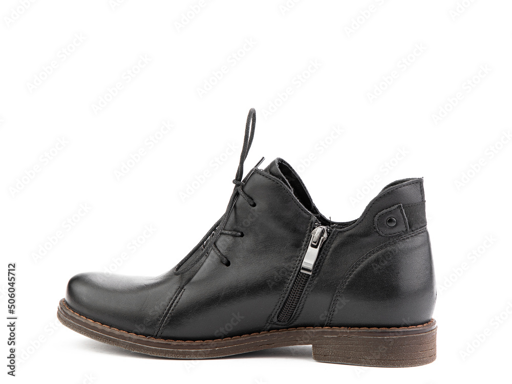 Women's autumn black leather jodhpur boots with laces and average heels, isolated white background. Left side view. Fashion shoes.