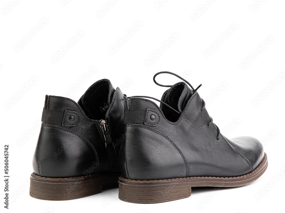 Women's autumn black leather jodhpur boots with laces and average heels, isolated white background. Back side view. Fashion shoes.
