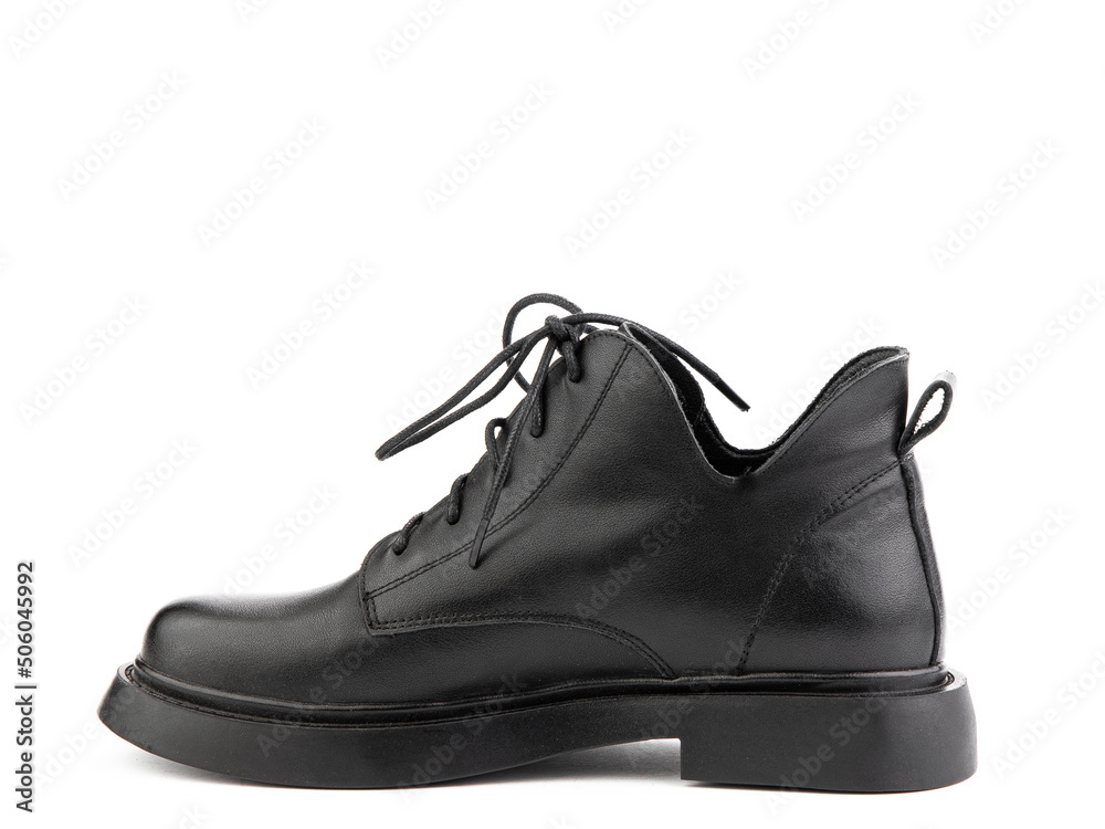 Women's autumn black leather jodhpur boots with laces and average heels, isolated white background. Left side view. Fashion shoes.