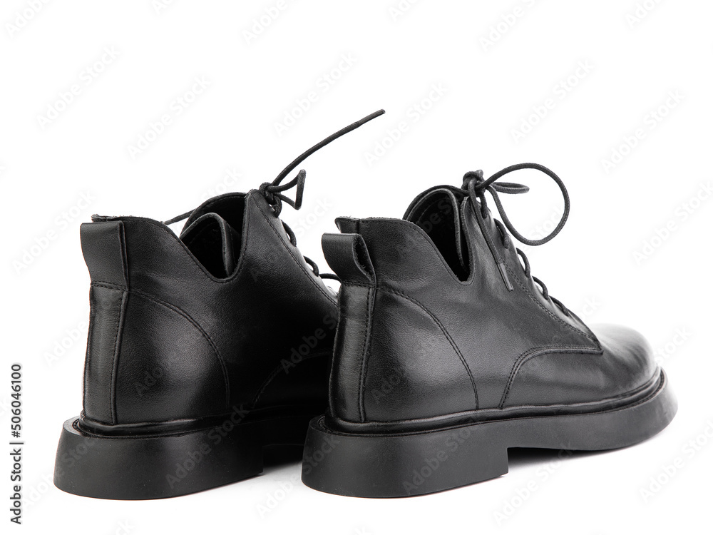 Women's autumn black leather jodhpur boots with laces and average heels, isolated white background. Back side view. Fashion shoes.