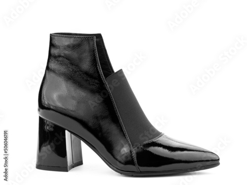 Obraz na płótnie Women's autumn ankle black leather boots with black zip and average heels, isolated white background. Right side view. Fashion shoes. w salonie